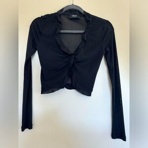 Cider: cropped, ruffle hem, button up, long sleeve blouse.